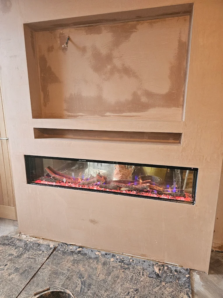 Fireplace media wall plastering feature
