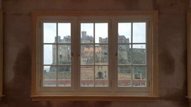 Edinburgh view through restored plastered window area
